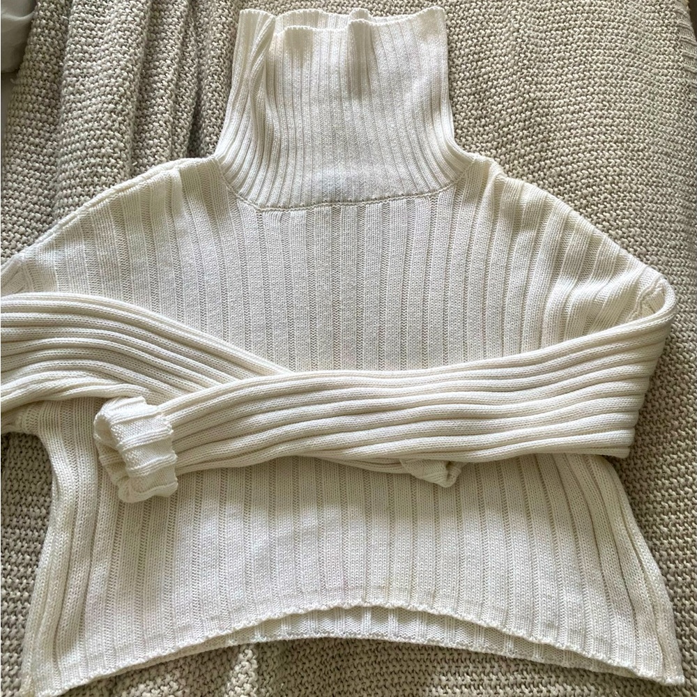Cream colored cropped turtleneck sweater